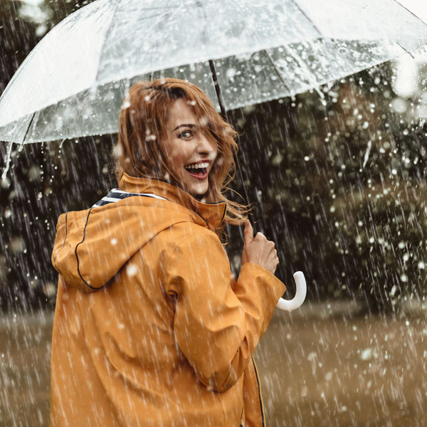 Girl using umbrella in the rain